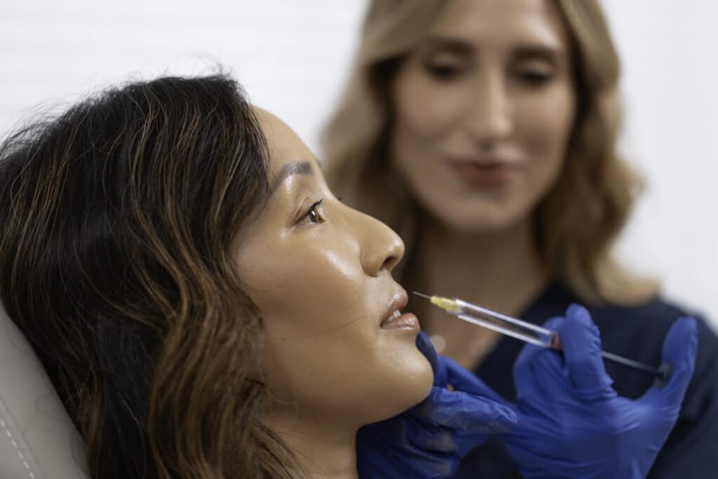 Dr. Ellis performing an injection on a patient