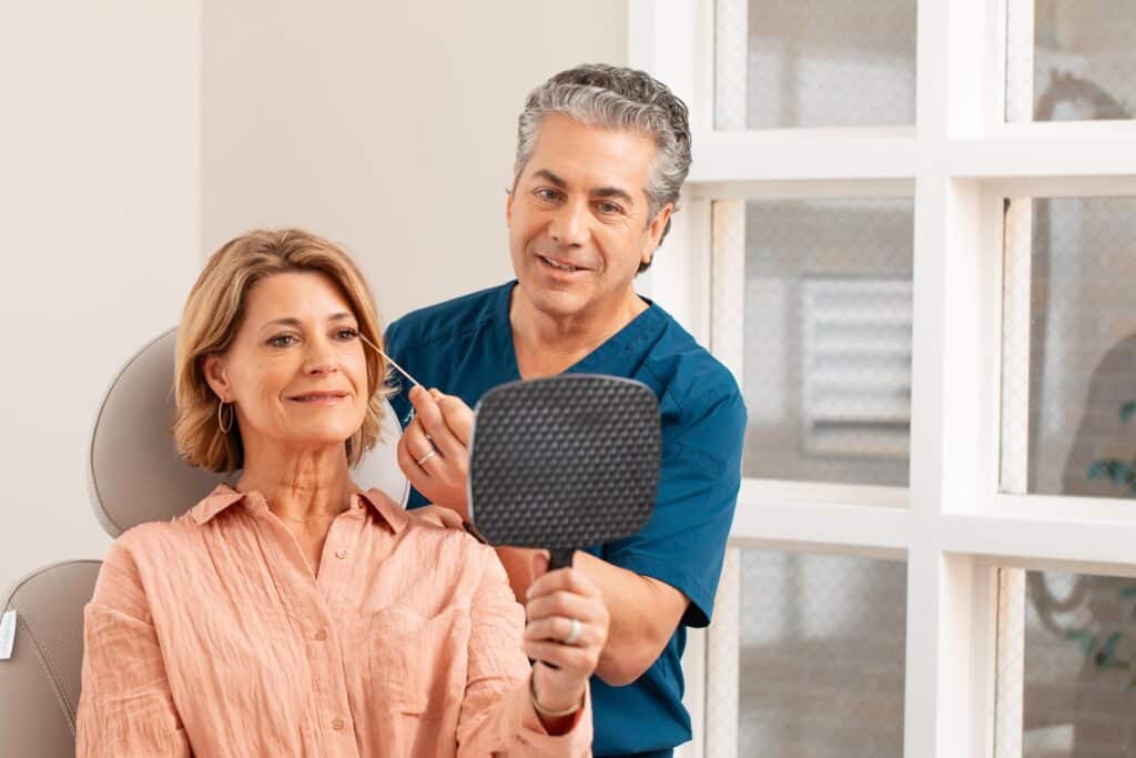 Dr. Potozkin consulting with a patient