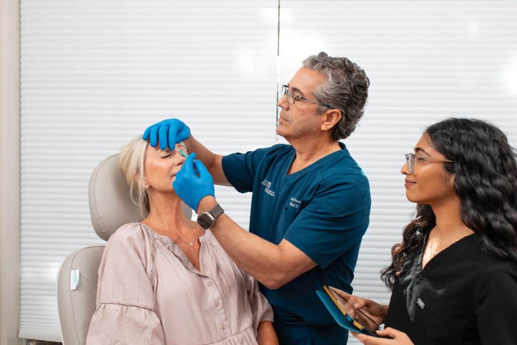 Dr. Potozkin during a procedure with a female patient