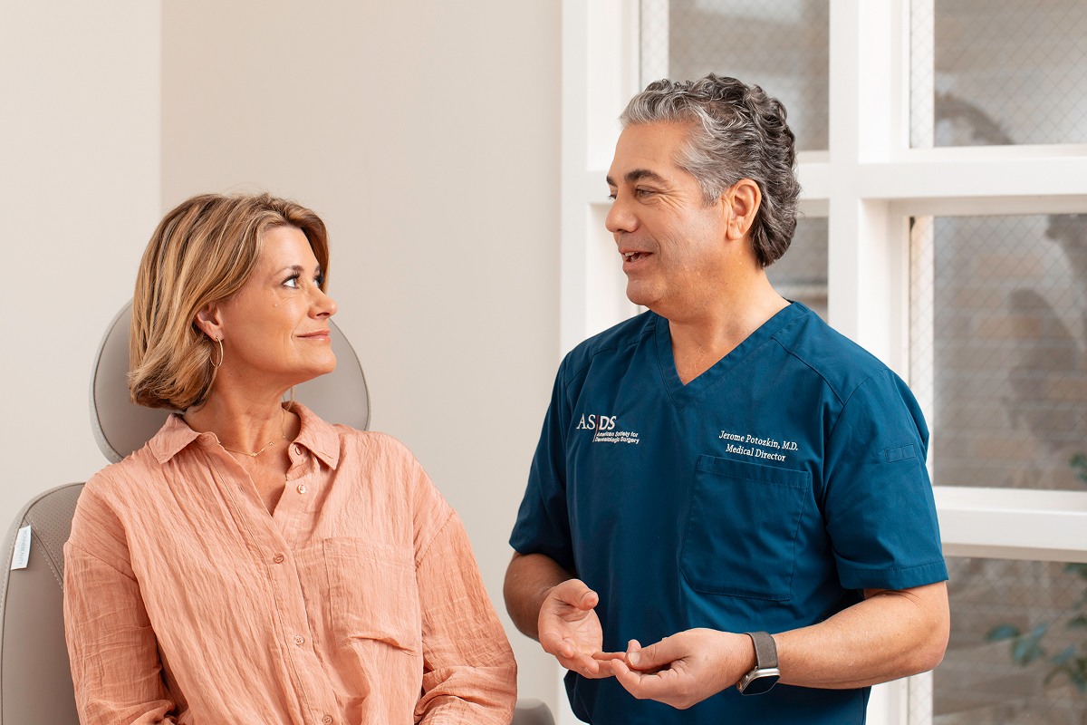 Dr. Potozkin talking with a female patient before the procedure