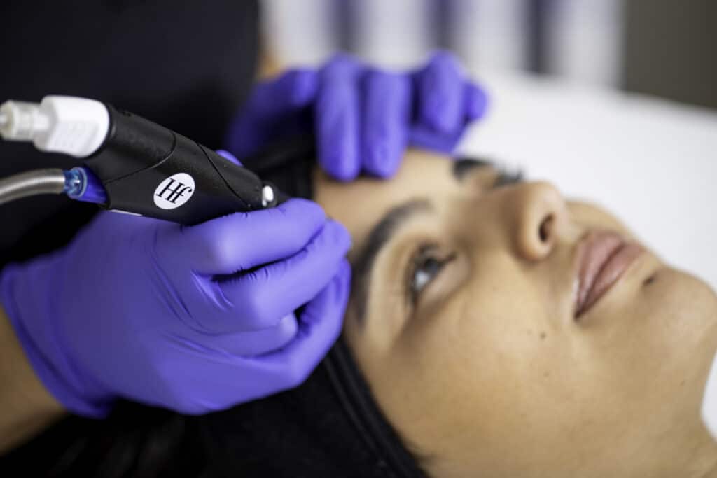 Provider performing an aesthetics treatment on a patient