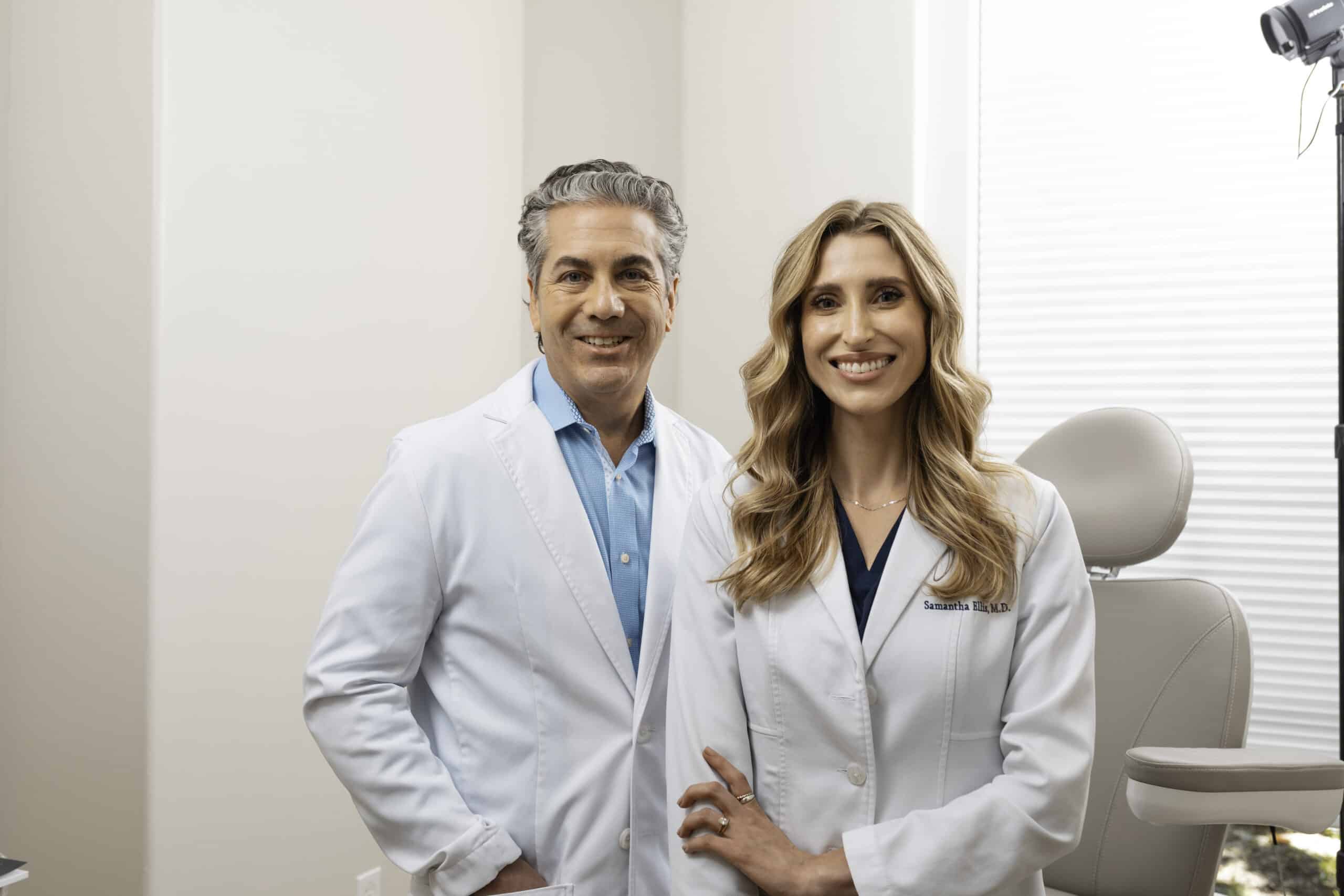 Dr. Potozkin and Dr. Ellis standing inside wearing medical white coats
